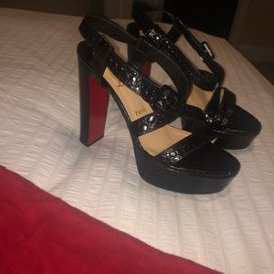 Christian Louboutin heels. Light scuffs on bottom, not visible when worn.